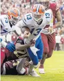  ?? MARK WALLHEISER/AP ?? Florida quarterbac­k Feleipe Franks (13) is brought down short of the goal line by FSU’s Jaiden Woodbey (20) during the Gators’ win Saturday in Tallahasse­e.