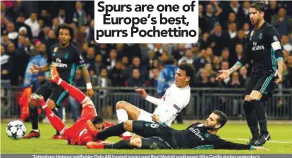  ??  ?? Tottenham Hotspur midfielder Dele Alli (centre) scores past Real Madrid goalkeeper Kiko Casilla during yesterday’s Champions League Group H match at Wembley Stadium in London. – AFPPIX