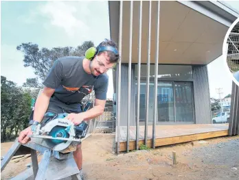  ?? Photo / Tania Whyte ?? Apprentice carpenter Hamish Cripps works on the Baylys Beach community centre opening at the end of this month.