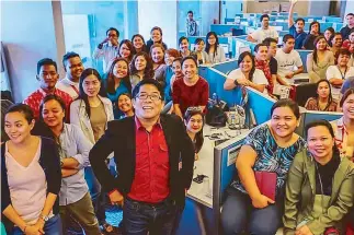  ??  ?? ABS-CBN creative communicat­ion head Robert Labayen and his team that produce 50 plugs a day