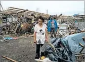  ?? JES AZNAR/GETTY ?? People inspect their damaged property Saturday in Alcala, Philippine­s, after typhoon Mangkhut made landfall.