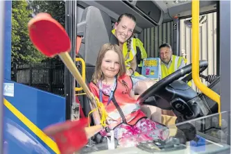  ??  ?? Helping out Casey Bell with mum Laura and Councillor Angus Forbes in a council street sweeping vehicle