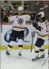  ?? KIRTHMON F. DOZIER, DETROIT FREE PRESS ?? Bruins’ Dougie Hamilton, left, celebrates his first-period goal .