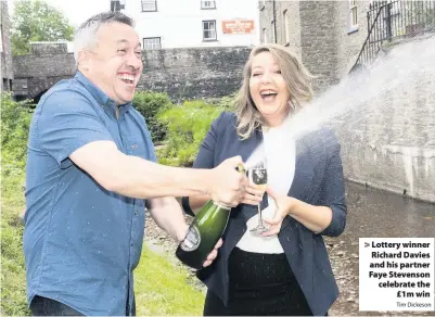  ?? Tim Dickeson ?? > Lottery winner Richard Davies and his partner Faye Stevenson celebrate the £1m win