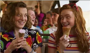  ??  ?? Eleven and Max (sadie, right) enjoy the delights of ice cream on ahot summer day.