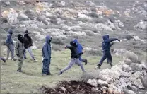  ?? PICTURE: EPA ?? Israeli settlers throw stones at security forces during the evacuation of the illegal Jewish settlement of Amona, in the West Bank.