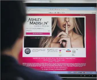  ?? LEE JIN-MAN/THE CANADIAN PRESS ?? Ashley Madison posted on its website a fictitious security award, a pair of privacy agencies involved in a yearlong investigat­ion say.