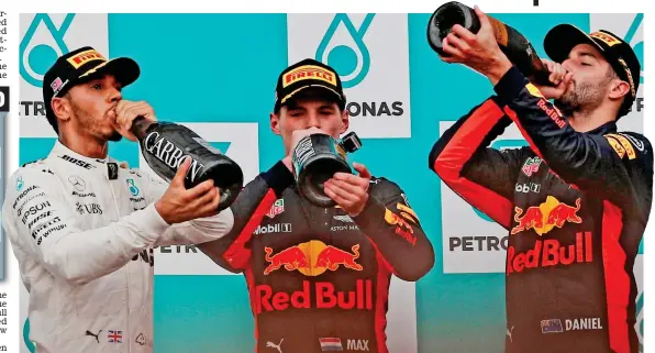  ?? REUTERS ?? Sweet taste of success: Lewis Hamilton (left) swigs the bubbly alongside winner Max Verstappen (centre) and Daniel Ricciardo