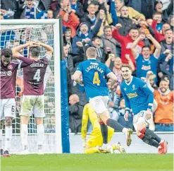  ?? ?? Midfielder John Lundstram celebrates opening the scoring for Steven Gerrard’s side