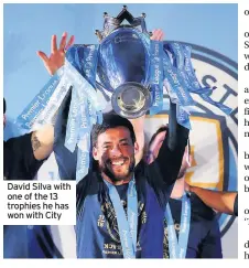  ??  ?? David Silva with one of the 13 trophies he has won with City
