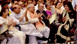  ?? — PTI ?? Lok Sabha Speaker Sumitra Mahajan and home minister Rajnath Singh applaud as Rio Paralympic­s medalist Deepa Malik proceeds to receive Padma Shri award from President Pranab Mukherjee during a function at Rashtrapat­i Bhavan in New Delhi on Thursday.