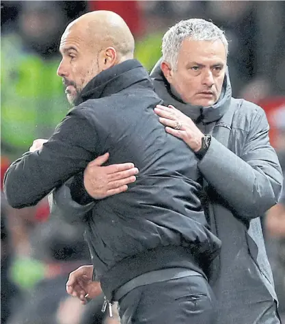  ??  ?? City manager Pep Guardiola, left, and then-Manchester United boss Jose Mourinho after a match in 2017.
