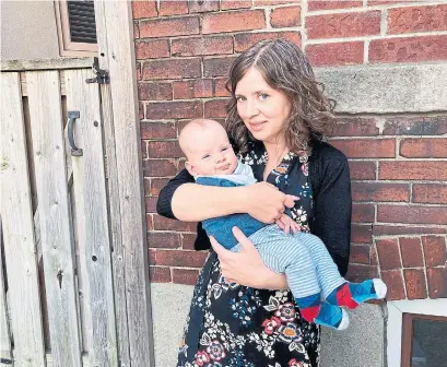  ?? EMILIY ANTZE ?? Emily Antze, seen with baby Theodore who was born in October, wishes it were possible her newborn and she could go to new moms' groups, baby swimming lessons and other activities together.