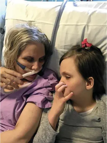  ?? Photo: contribute­d ?? SECOND CHANCE: April Hitzke and daughter Chloe enjoy a cuddle before her lung transplant surgery in May.