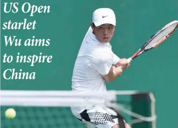  ?? — AFP ?? Wu Yibing of China hitting a return against Li Zhe during their quarterfin­al match at the National Games of China event in Tianjin.