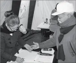  ?? FILE PHOTO ?? A FARM WORKER UNDERGOES AN EXAM DURING THE ANNUAL Dia del Campesino event in San Luis. The event takes place again Dec. 2 on Main Street in the city.