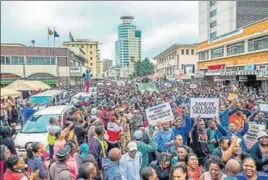  ?? AFP ?? People at a demonstrat­ion demanding the resignatio­n of Mugabe on Saturday in Harare.