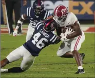  ?? (AP/Rogelio V. Solis) ?? Ole Miss linebacker MoMo Sanogo (46) said the Rebels’ struggling defense can still improve this season, much like Arkansas has accomplish­ed already.