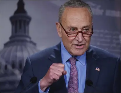  ?? J. SCOTT APPLEWHITE — THE ASSOCIATED PRESS ?? Senate Majority Leader Chuck Schumer, D-NY, speaks to reporters at the Capitol in Washington, July 26. Schumer recently worked with Sen. Joe Manchin, D-WV, on a spending plan that includes the expansion of workers and budget at the Internal Revenue Service.