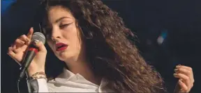 ??  ?? NEW VOICE: Lorde in concert. The 17-year-old New Zealand star has two Grammy nomination­s.