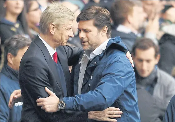  ??  ?? Arsenal manager Arsene Wenger, left, and Tottenham boss Mauricio Pochettino during an EPL match last season.