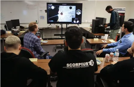  ?? — AFP photo ?? Scorpius team members watch a live feed as the Spacecraft Odysseus lands on the moon from Scorpius Space Launch Company in Torrance, California.