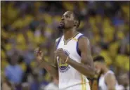  ?? MARCIO JOSE SANCHEZ — THE ASSOCIATED PRESS FILE ?? In this file photo, Golden State Warriors forward Kevin Durant reacts after scoring against the Cleveland Cavaliers during the second half of Game 5 of basketball’s NBA Finals in Oakland. A person with knowledge of the situation tells The Associated...