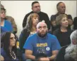  ?? MORGAN TIMMS/Taos News ?? Community members listen as superinten­dent Lisa Hamilton speaks during public comment March 9 at Peñasco Elementary School. A divide is growing in the community between those who support the superinten­dent and those who don’t, many of whom spoke up at a September town hall.