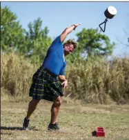  ?? (Democrat-Gazette file photo/Stephen Swofford) ?? Jeffrey Atkinson practices the weight throw in this 2021 photo as he and friends prepare for the Scottish Highland games during the Scottish Festival at Lyon college in Batesville.