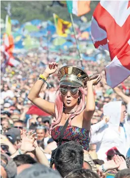  ?? ?? HAVING A BALL: Clockwise from above left – Music fans at T in the Park at Balado; wellies are a must for coping with the muddy fields at many festival sites; Glastonbur­y has always been one of the hottest tickets of the summer festival season.