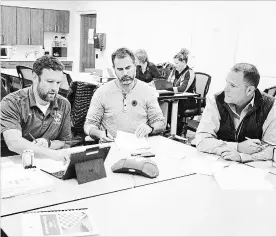  ?? BOB TYMCZYSZYN THE ST. CATHARINES STANDARD ?? Councillor and budget standing committee chair Mat Siscoe, radio host Tom McConnell and St. Catharines Mayor Walter Sendzik speak with residents in a telephone town hall meeting from the fire station in Merritton on Tuesday night.