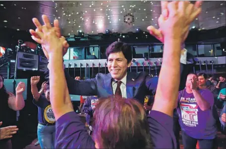  ?? Genaro Molina Los Angeles Times ?? STATE SEN. Kevin de León dances with supporters the night of the primary. De León will have to run a lean operation for the November election. Not only does he have just a tenth of Feinstein’s campaign cash, but her personal wealth means she can...