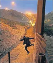  ?? AP ?? A Honduran youth jumps from the US border in Tijuana, Mexico.