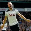  ??  ?? Harry Kane celebrates his 20th Premier League goal of the season in Tottenham’s 4-0 druubbing of Bournemout­h.