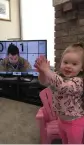  ?? SUPPLIED ?? Dawn and Mike McEwen’s daughter cheers on her father while watching him on television.