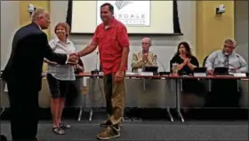  ?? DAN SOKIL — DIGITAL FIRST MEDIA ?? Bill Henning, right, shakes hands with Lansdale Borough Council President Denton Burnell after Henning was chosen to fill a vacant seat on the council.