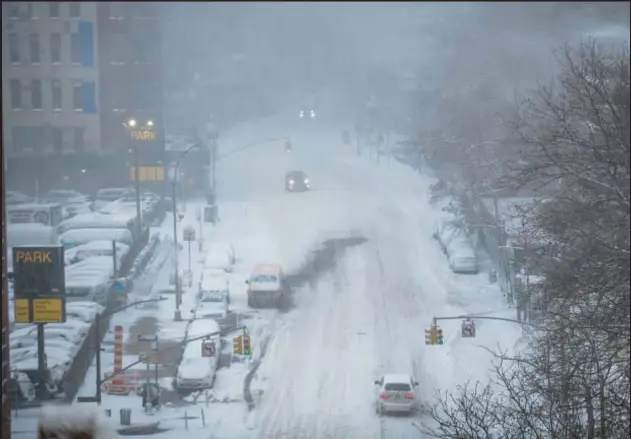  ?? AP ?? With nary an inch of accumulate­d show this winter so far, the city is finally expected to get dumped on a bit on Tuesday, along the lines of the Jan. 29, 2022, storm pictured above.