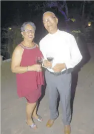  ??  ?? Ossie Chang, retired constructi­on administra­tor and his wife Valerie, Sherwinwil­liams sales representa­tive, raised pinot noir toasts to King George.