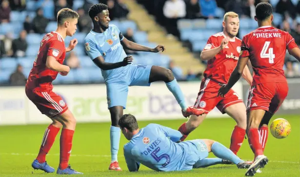  ?? TIM BASTHOPE ?? Accrington Stanley defenders combine out City's Jordy Hiwbula during Sraturday's 1-1 draw at the Ricoh Arena