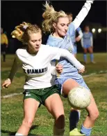  ??  ?? Monache High School’s Rachel Clement, right, battles for a ball Tuesday.