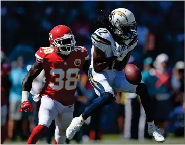  ?? AP PHOTO BY KELVIN KUO ?? Los Angeles Chargers wide receiver Travis Benjamin, right, drops a pass under pressure form Kansas City Chiefs defensive back Ron Parker during the first half of an NFL football game Sunday, Sept. 9, in Carson, Calif.