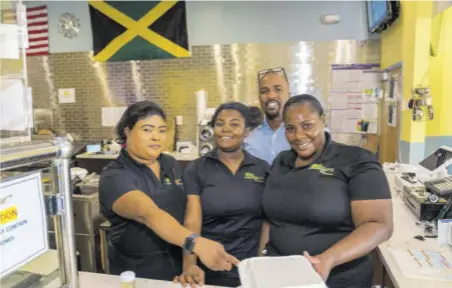  ?? ?? From left, Colette, Jamelie, and Dacosta, members of the frontline staff of Negril Jamaican Restaurant.