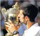  ?? Picture: MICHAEL STEELE /GETTY IMAGES ?? BLESSED RELIEF: Novak Djokovic kisses the trophy after winning the Wimbledon men’s singles final on Sunday