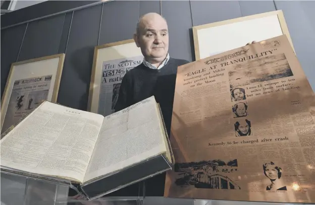  ??  ?? 0 Ian Scott, the curator of the display at the National Library of Scotland which marks 200 years of The Scotsman newspaper