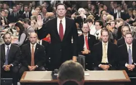  ?? Mark Wilson Getty Images ?? JAMES B. COMEY said he declined to publicly declare the president was not under investigat­ion because he would have to announce otherwise if that changed.