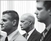  ?? ANTONIO PEREZ/CHICAGO TRIBUNE ?? Kane County State’s Attorney Joe McMahon, center, is handling the case of Chicago Officer Jason Van Dyke, right.