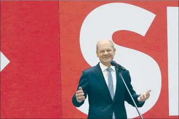  ?? Wolfgang Kumm DPA ?? OLAF SCHOLZ, the leader of the Social Democrats, speaks at party headquarte­rs in Berlin. He called for the outgoing chancellor’s Union bloc to go into opposition after it saw its worst-ever result in a national election.