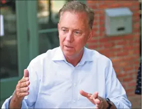  ?? Christian Abraham / Hearst Connecticu­t Media ?? Gov. Ned Lamont: “Some of these things are sort of complicate­d. You’ve got to get the right ID number in there and such. Look, it’s not easy for everybody, especially those of us of a certain age.”