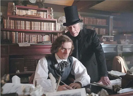  ?? ELEVATION PICTURES ?? Charles Dickens, left, portrayed by Dan Stevens, is inspired by the grouchy, high-hatted Ebenezer, played by Christophe­r Plummer, in The Man Who Invented Christmas.