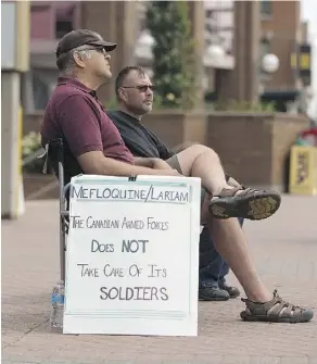  ?? GREG SOUTHAM ?? Ex-soldier Dave Bona says he has suffered many side effects after taking the antimalari­al drug mefloquine. He and former soldier and friend Darrell Beaton protested outside Canada Place on Wednesday.